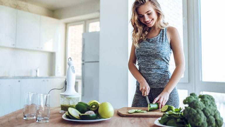 lady-cooking,-nutrients-to-boost-immunity-by-healthista.com