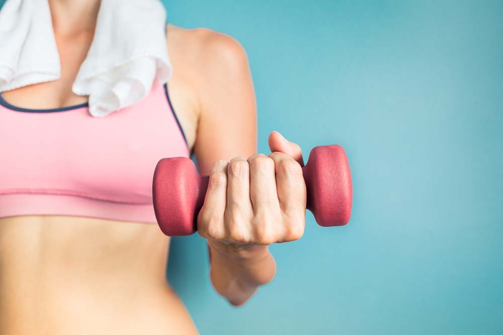 Hormones-out-of-balance-These-7-lifestyle-hacks-will-help-Woman-lifting-weights