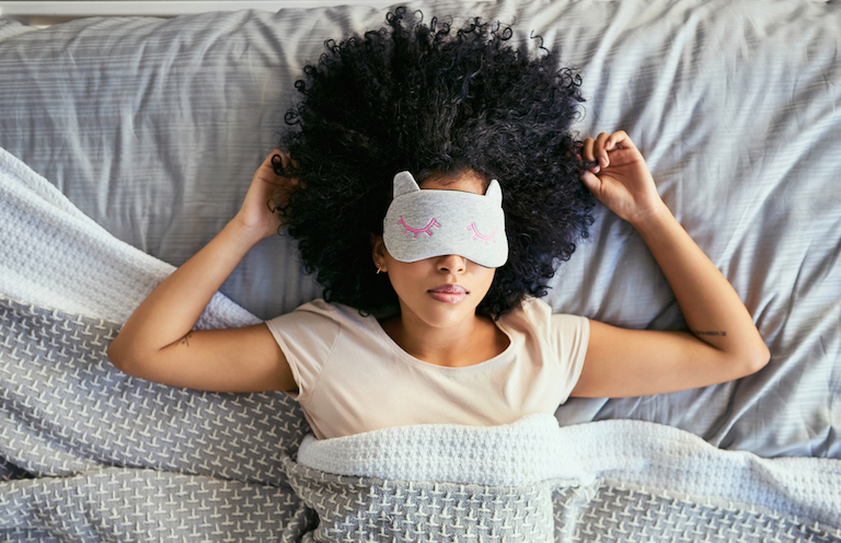 woman-sleeping-with-eyemask-causes-of-tiredness-healthista