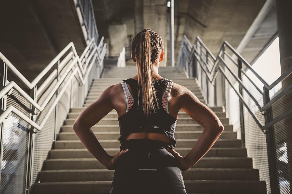 bad-habits-one-step-at-a-time-woman-stodd-at-bottom-of-stairs.jpg