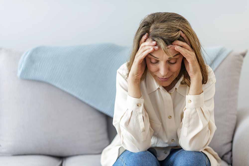 exhausted-woman-sat-on-sofa-betteryou.jpg