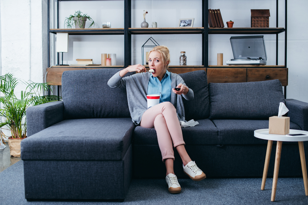 Woman-on-sofa-eating-ice-cream-stress-fixer.jpg