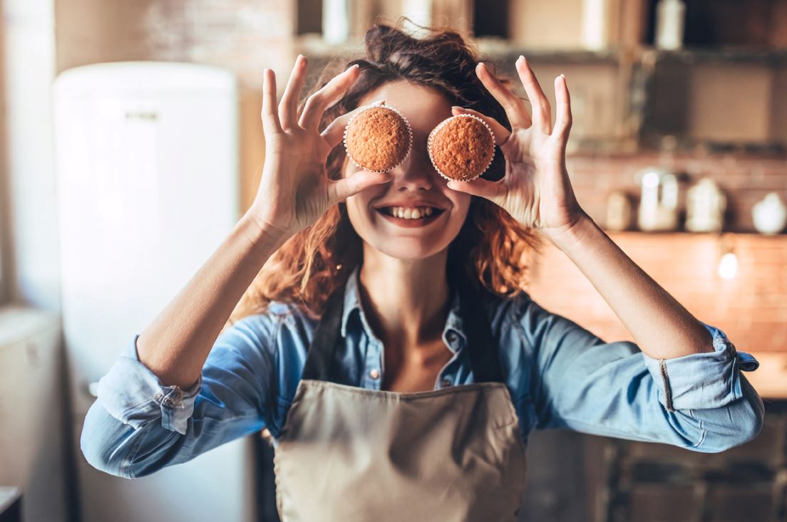 Woman baking cupcakes how to be happier