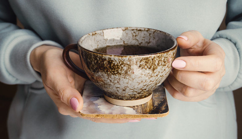 Hands with tea cup