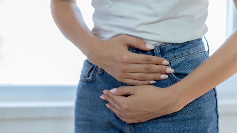 bloated again stress woman bloated holding stomach