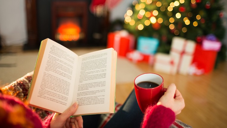 9-helpful-tips-for-a-healthy-happy-Christmas-woman-reading-a-book-at-christmas.jpg