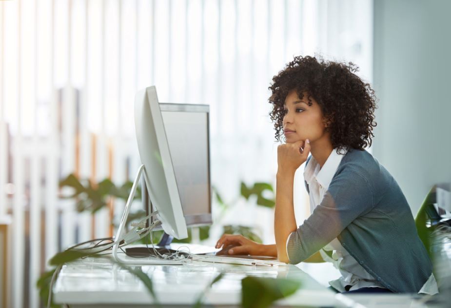 Gender stereotypes at work woman sat at her desk