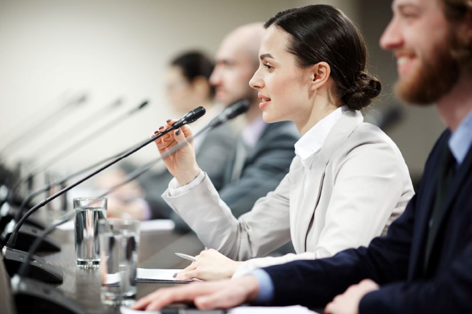 Gender stereotypes at work woman speaking into microphone