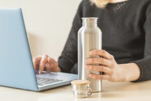 tired all the time stay hydrated keep water bottle on desk