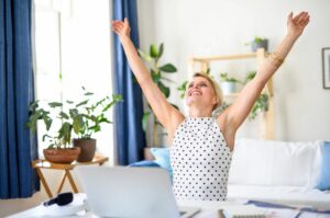 full body stretches arm circles woman at desk