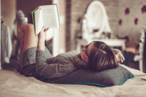 6 ways to overcome self-doubt - an experts guide do something you love woman reading in bed