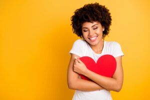 6 ways to overcome self-doubt - an experts guide woman holding love heart