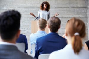 How To Find Your Inner Confidence And Keep It woman talking to crowd