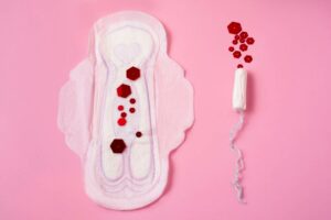 Menorrhagia a gyneacologists guide to heavy menstrual bleeding pad and tampon with glitter blood