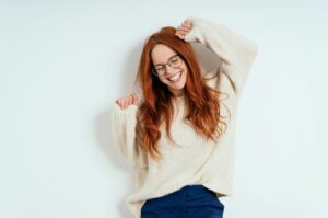 benefits of taking a brain break young woman smiling and happy with energy