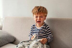 young boy looking upset and crying mental health disorder