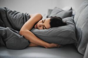 woman asleep cbd promotes sleep