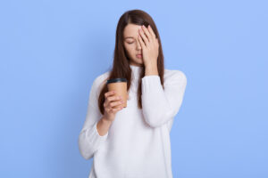 woman-holding-caffeine-drink-.jpg