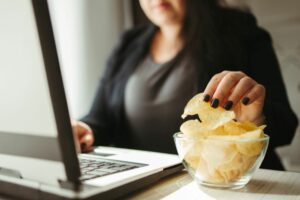 woman stress eating bad food