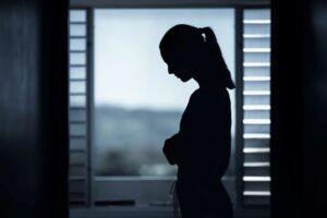 mental health awareness week loneliness woman alone at home looking sad