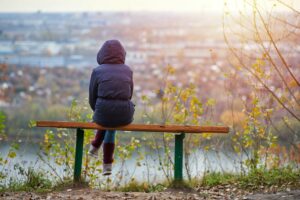 mental health awareness week loneliness woman on bench alone