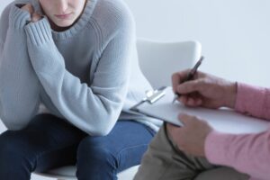 mental health awareness week loneliness woman talking to GP