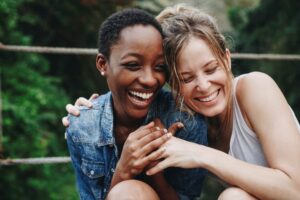 kindness two women hugging and smiling