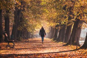 move often weight loss woman walking through park