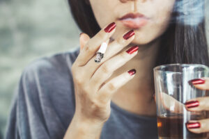 woman-smoking-and-drinking-alcohol-menopause-tips.jpg