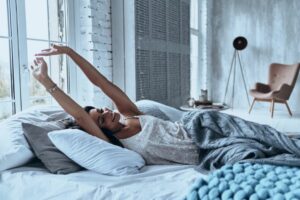 circadian rhythm woman waking up from restful sleep