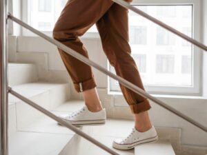 trends 2023 exercise as movement woman walking upstairs