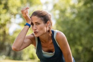 woman tired during running menopause pms