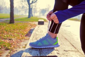 woman tying her running shoes london marathon inspiration